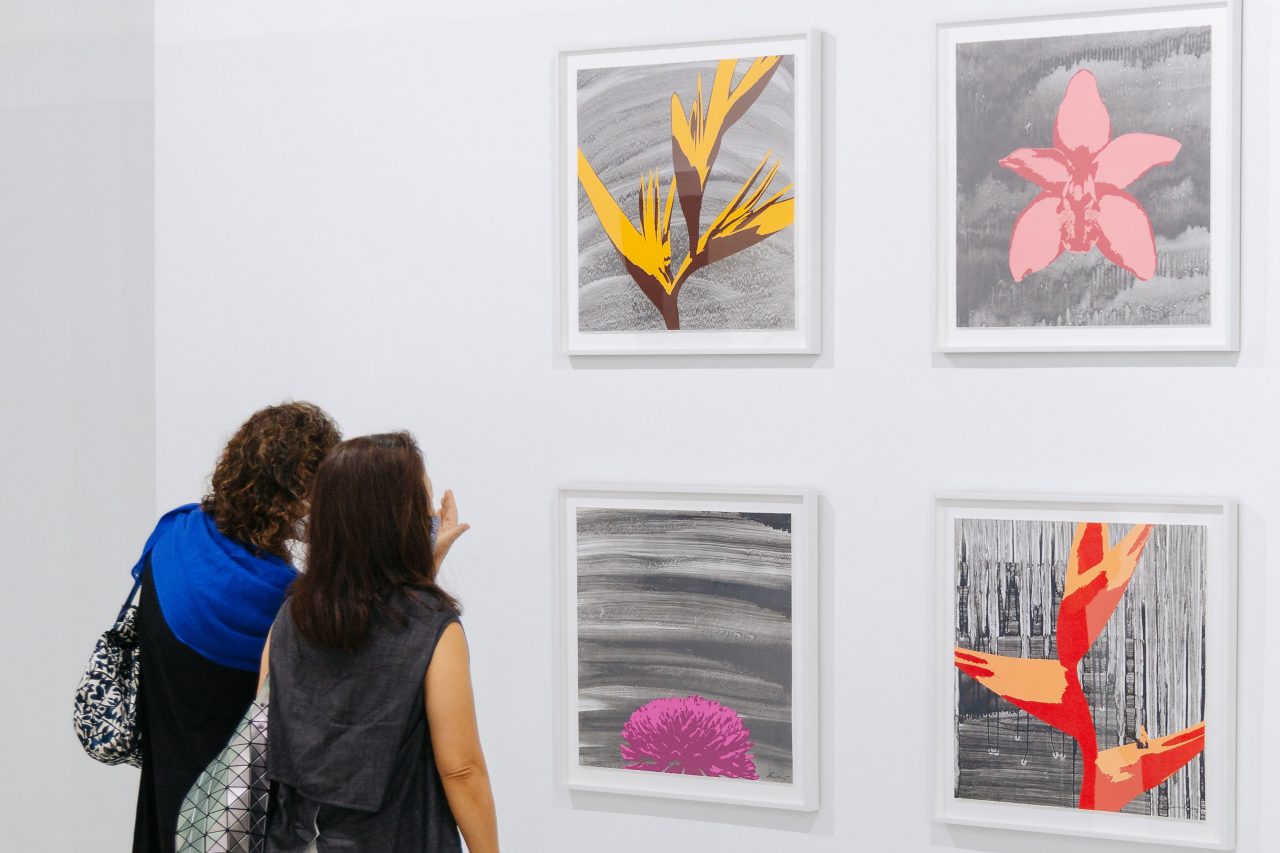 From upper left, clockwise: Russel Wong, "Heliconia", "Cymbidium Orchid", "Heliconia Wagneriana", "Chrysanthemum", 2020. Photolithography on paper, edition of 12, 60 x 60 cm, presented by STPI – Creative Workshop & Gallery. Photo by Toni Cuhadi, courtesy of S.E.A. Focus, Singapore