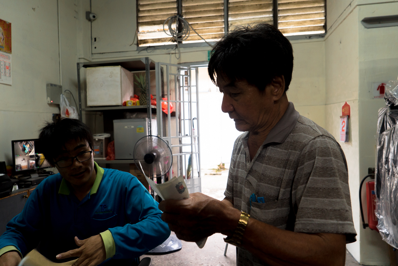 Mr Tan counting his earnings for the day.