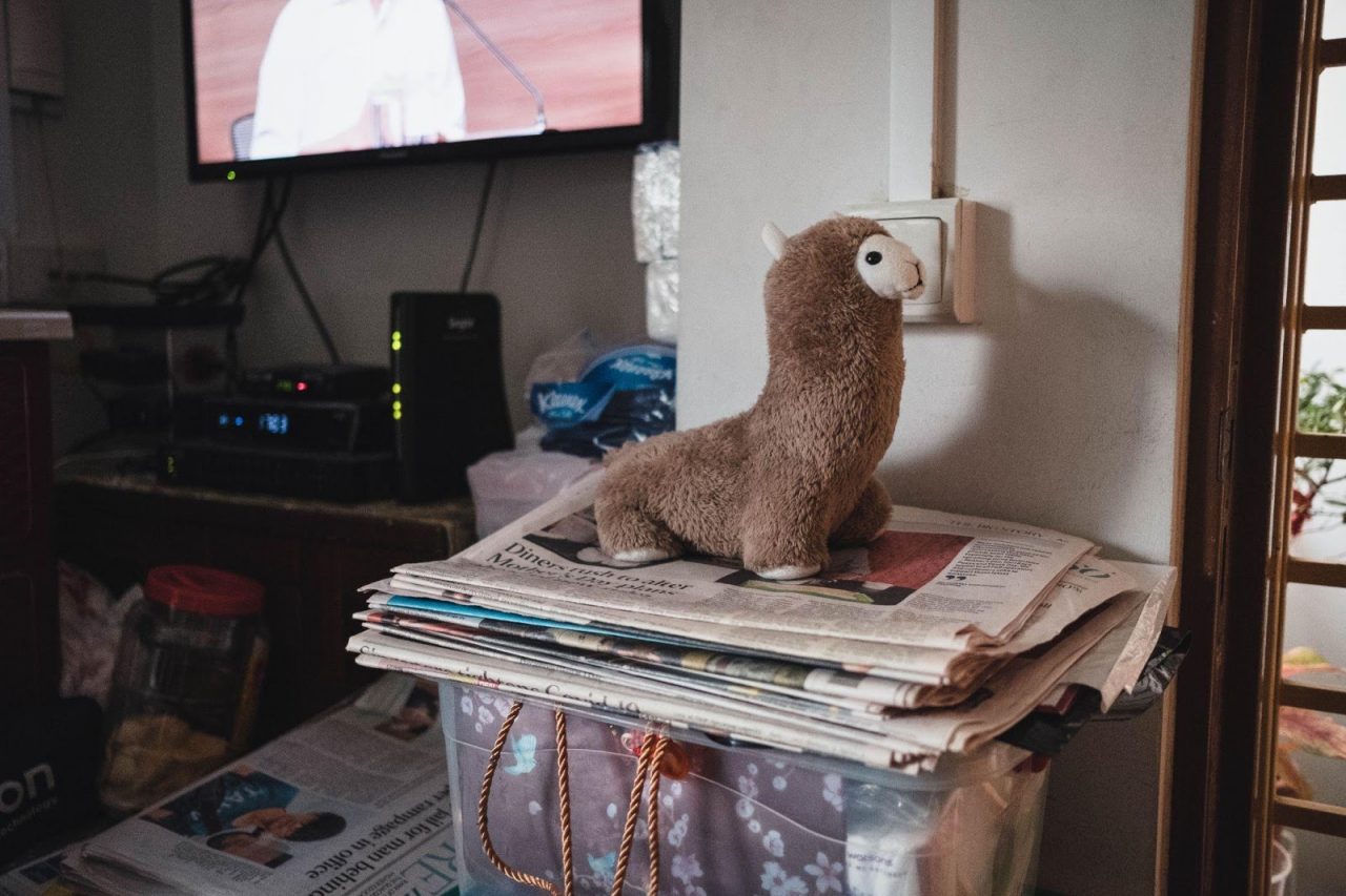 A stack of daily newspapers to be shared with her neighbours.