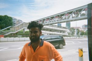 Through Their Lenses: Migrant Workers