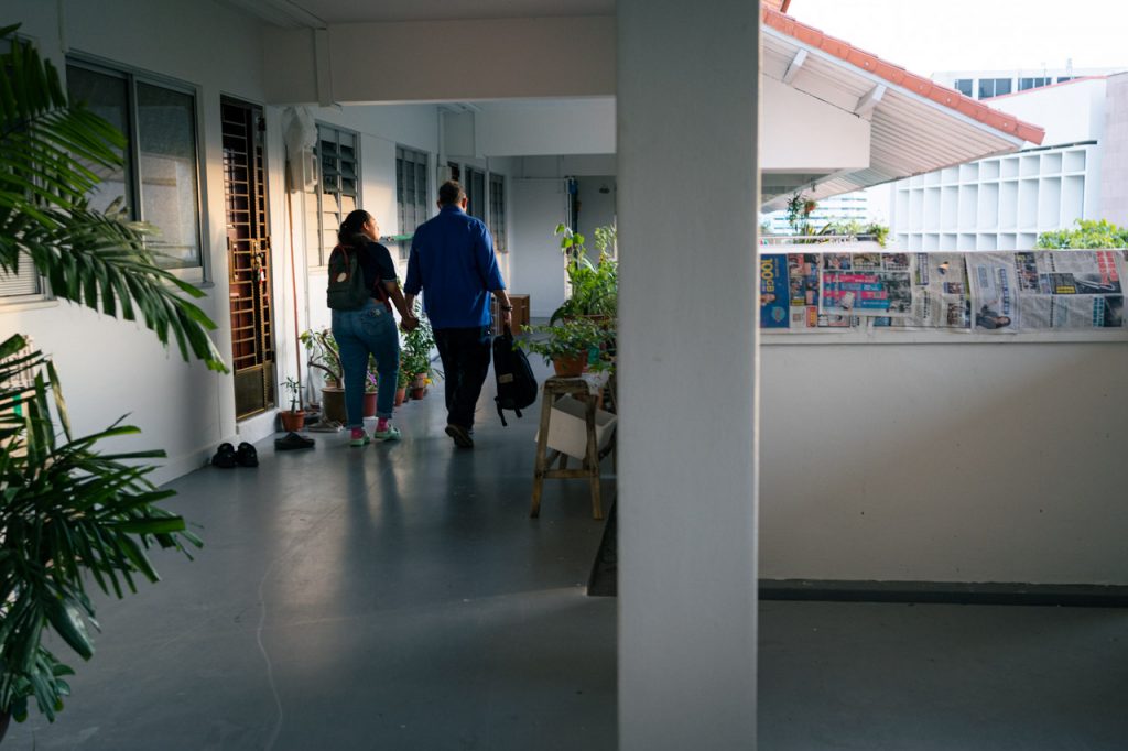 A couple returns home to their comfortable HDB apartment.